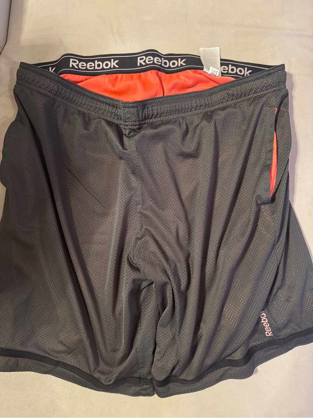 Reebok Men’s Black Athletic Shorts with Orange Liner Trim
